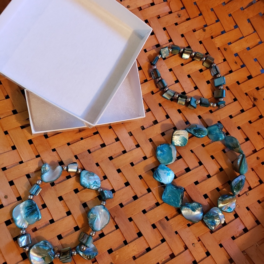 Three blue shell bead bracelets